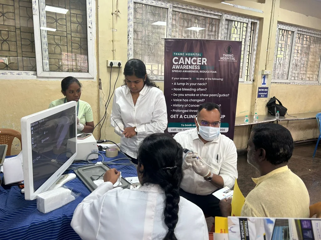 Doctor performing endoscopy at Rotary Club cancer screening camp for corporation workers