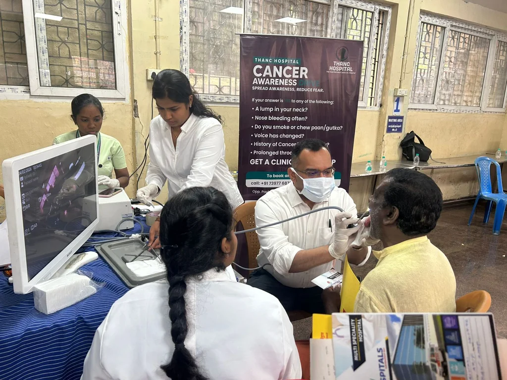 Throat examination at cancer screening for corporation sanitary workers